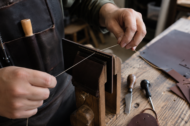 Saddle-stitching a leather panel with waxed thread