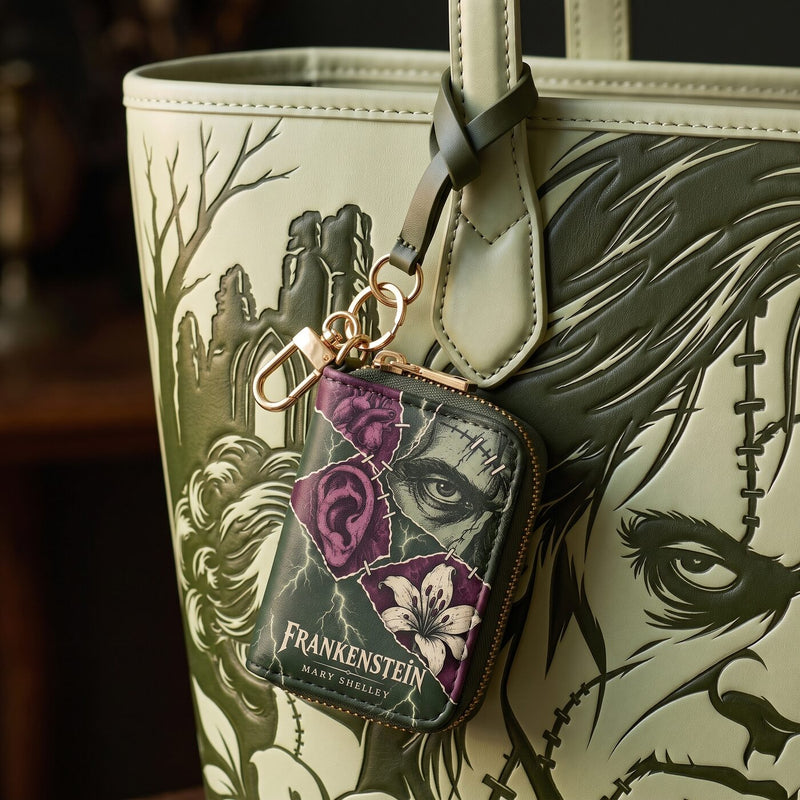 The Creature matching book-cover charm on the tote
