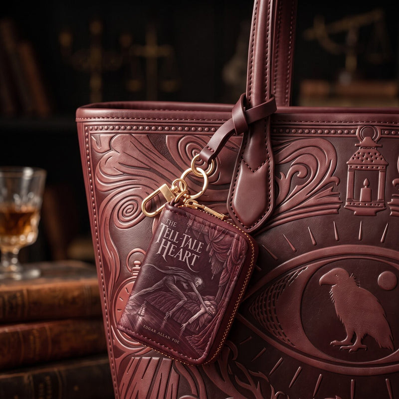 The Vulture Eye matching book-cover charm on the tote